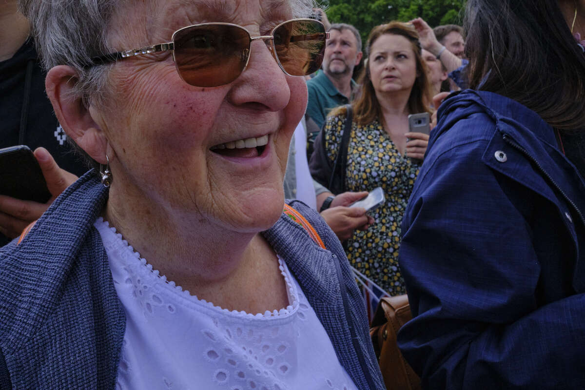 Grandma happy to see the Queen